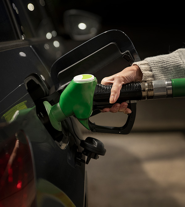 Close up hand holding gas pump